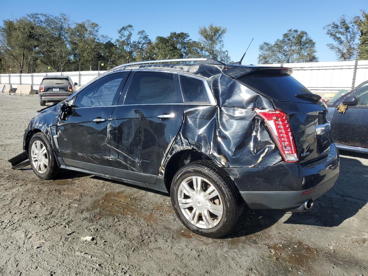 2011 Cadillac SRX VIN 3GYFNBEY5BS670798 Copart auction photo, rollover damage thumbnail 2