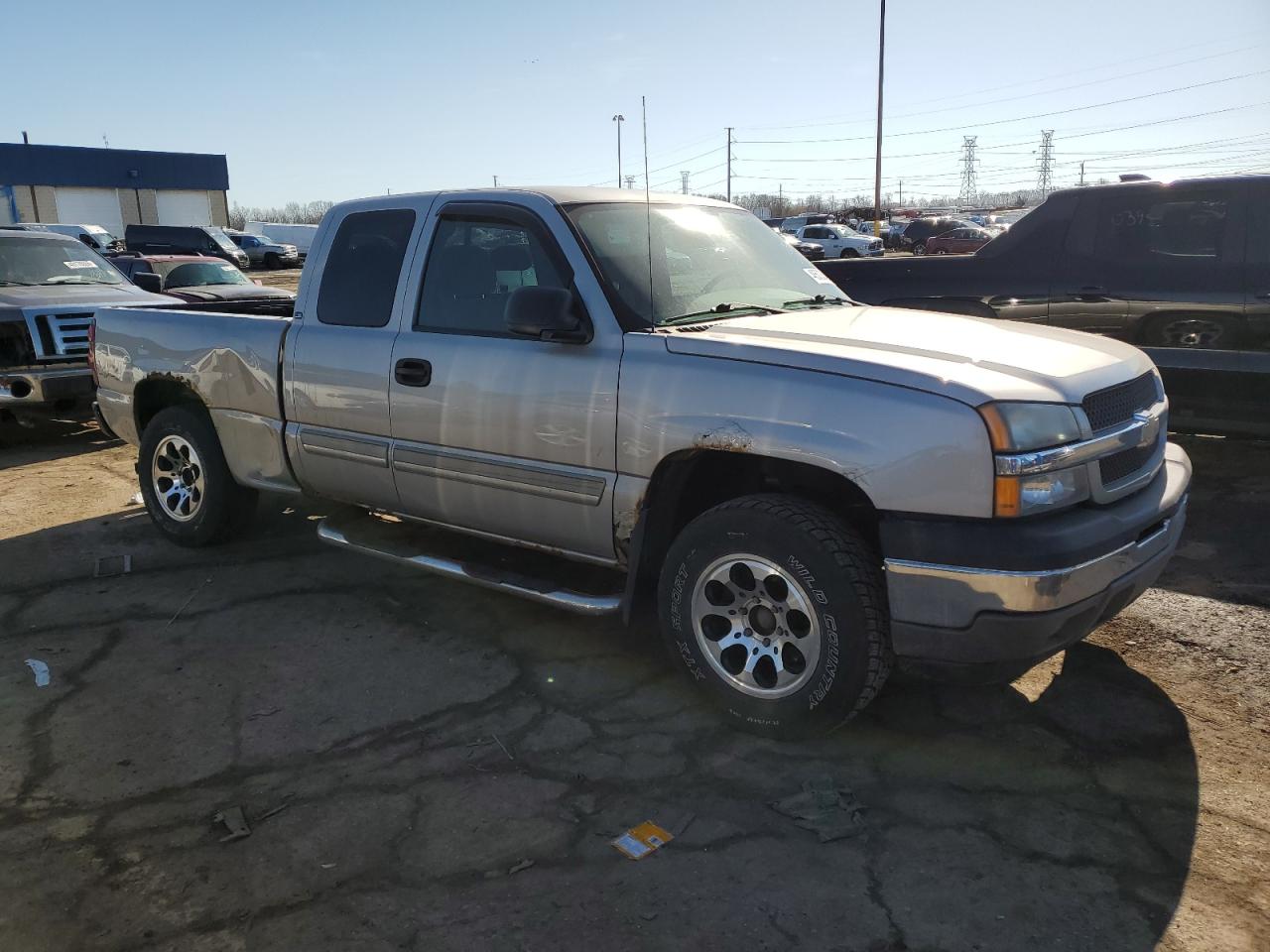 2005 Chevrolet Silverado VIN 2GCEK19B851344844 Copart auction photo, side / rear end damage thumbnail 4