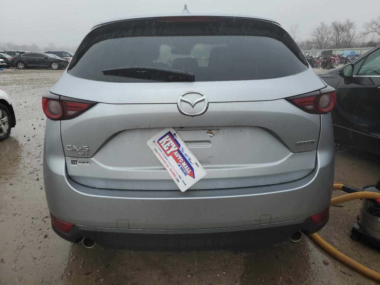 2021 Mazda CX-5 VIN JM3KFBDM4M1374618 Copart auction photo, front end / undercarriage damage thumbnail 6