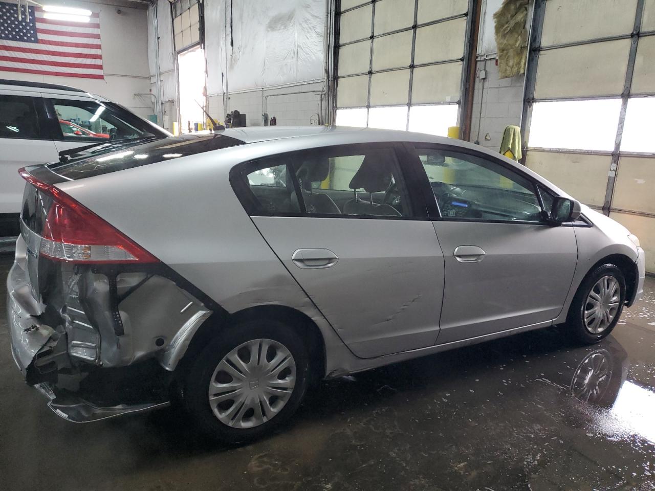 2010 Honda Insight VIN JHMZE2H58AS010977 Copart auction photo, rear end / side damage thumbnail 3