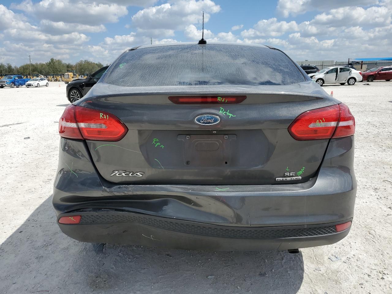 2015 Ford Focus VIN 1FADP3F20FL345808 Copart auction photo, rear end / minor dent/scratches damage thumbnail 6