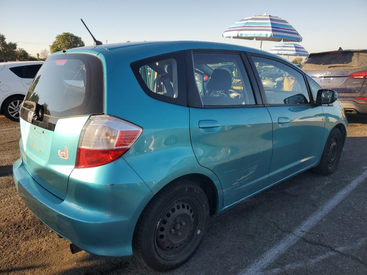 2012 Honda Fit VIN JHMGE8H39CC033609 Copart auction photo, side / front end damage thumbnail 3