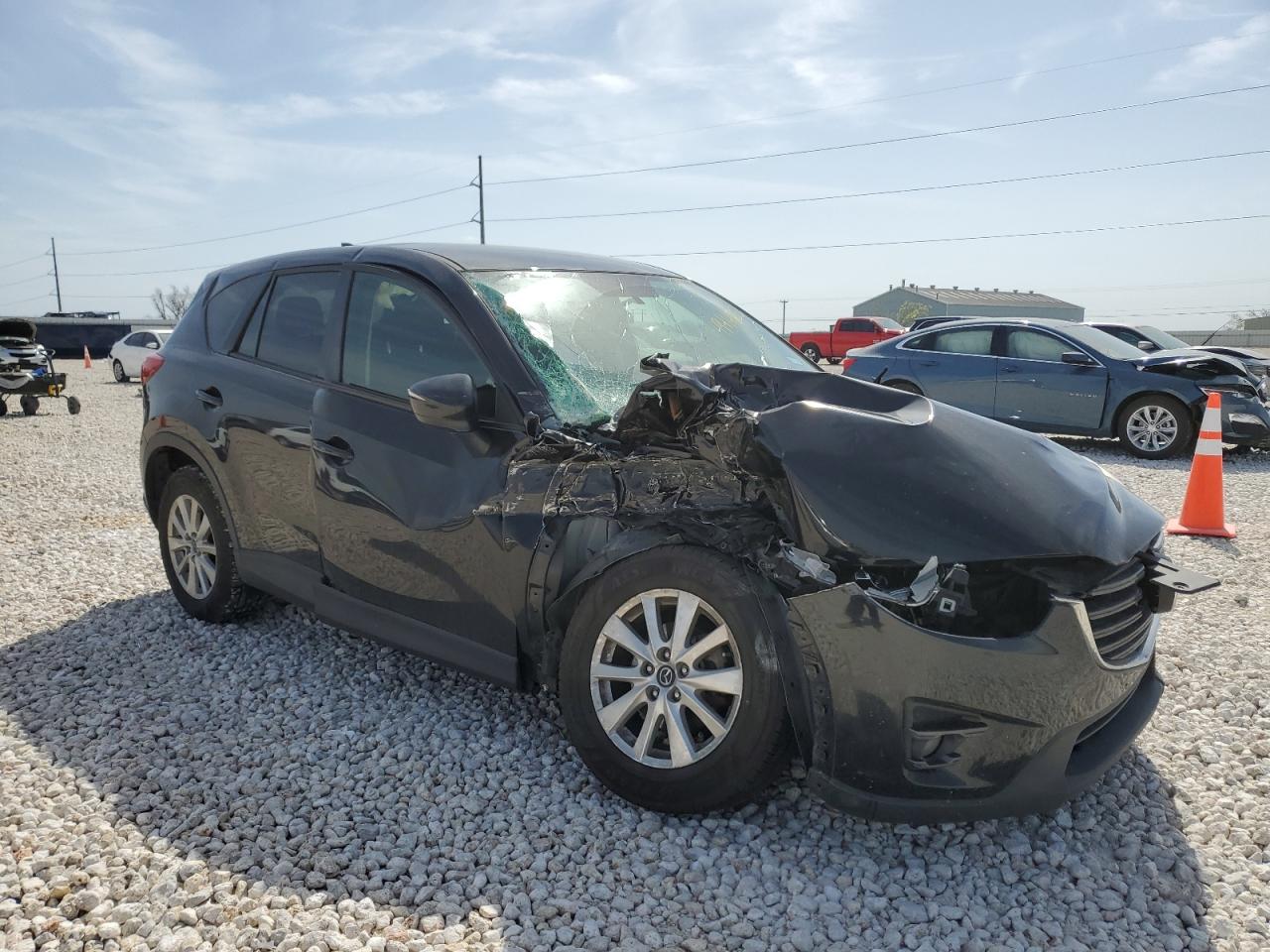 2016 Mazda CX-5 VIN JM3KE4CY5G0667179 Copart auction photo, side / front end damage thumbnail 4