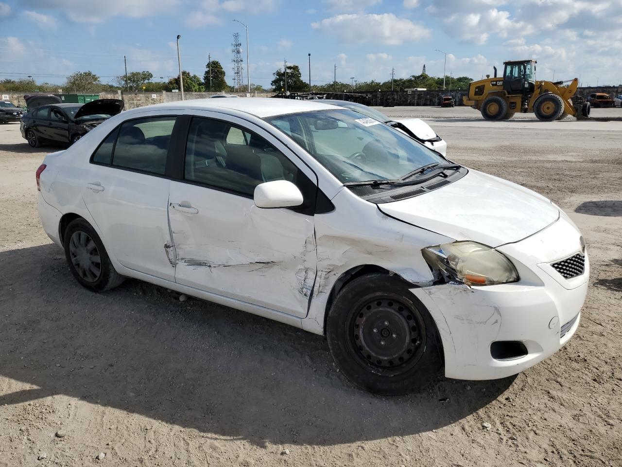 2012 Toyota Yaris VIN JTDBT4K34CL017143 Copart auction photo, front end / side damage thumbnail 4