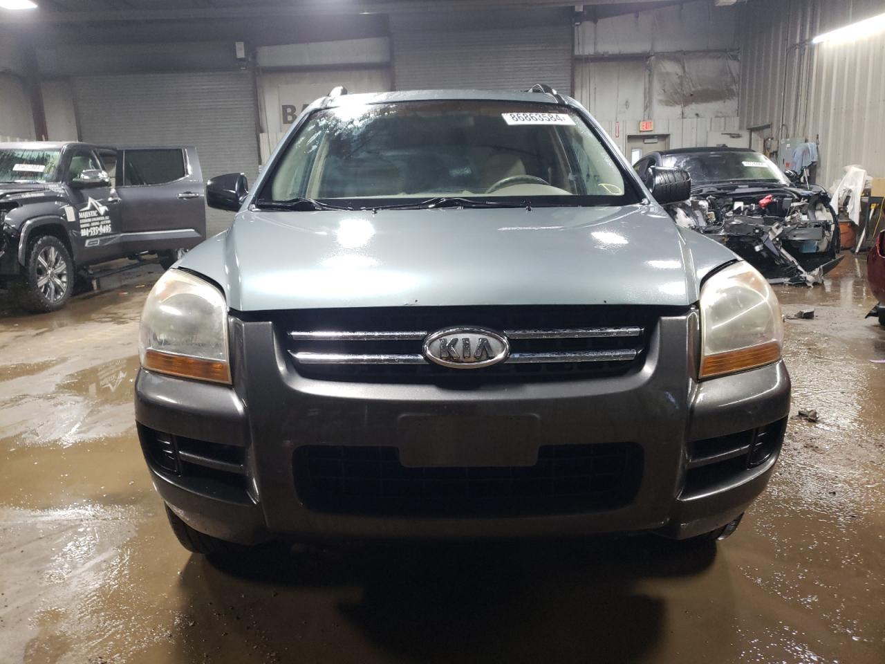 2007 KIA Sportage VIN KNDJE723077349991 Copart auction photo, rear end damage thumbnail 5