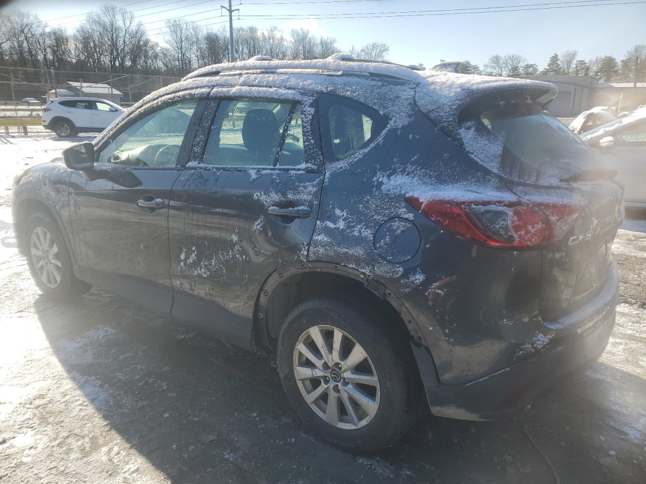 2015 Mazda CX-5 VIN JM3KE2BE9F0544978 Copart auction photo, side / minor dent/scratches damage thumbnail 2