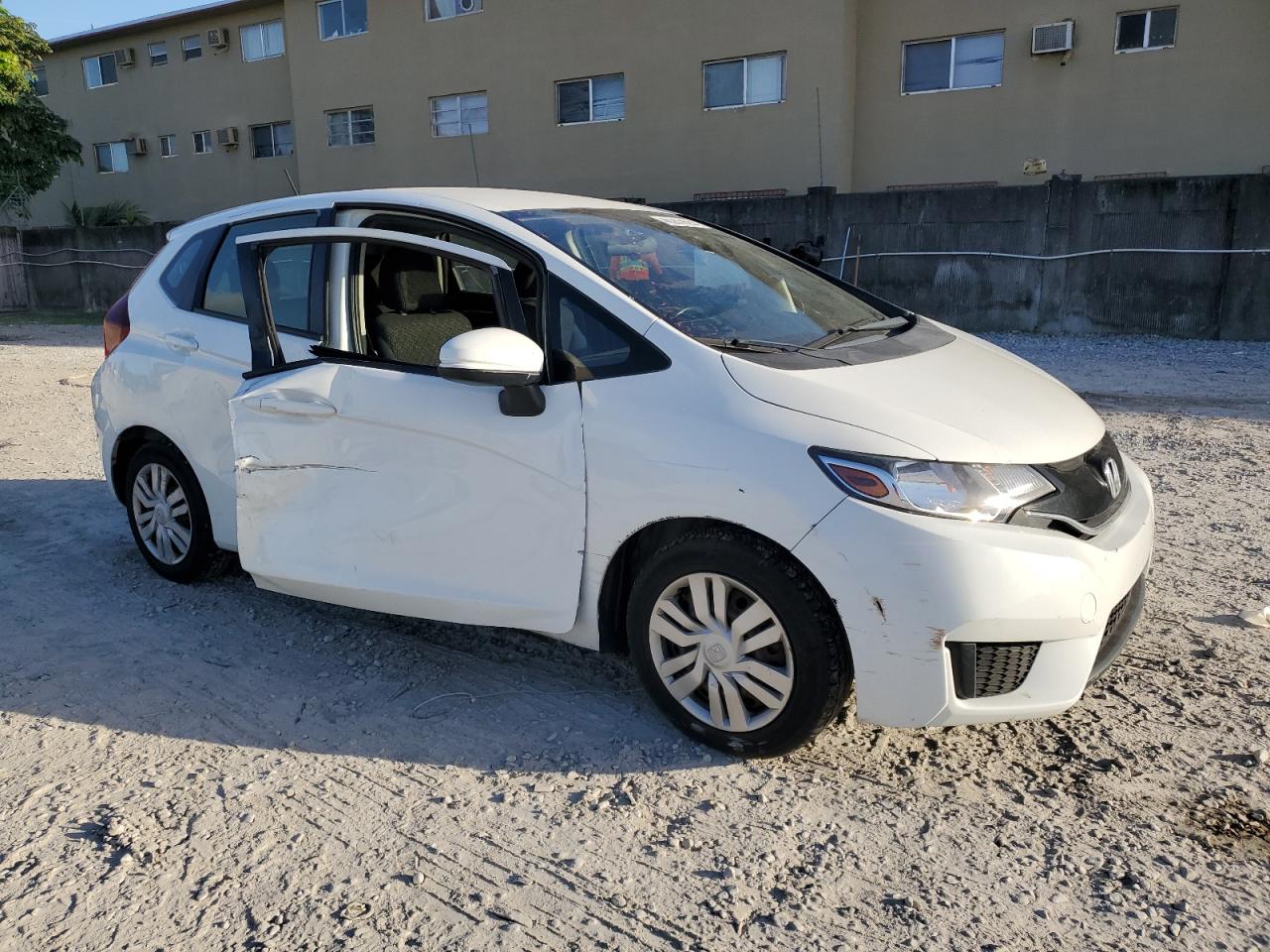 2016 Honda Fit VIN JHMGK5H51GS006909 Copart auction photo, side / front end damage thumbnail 4