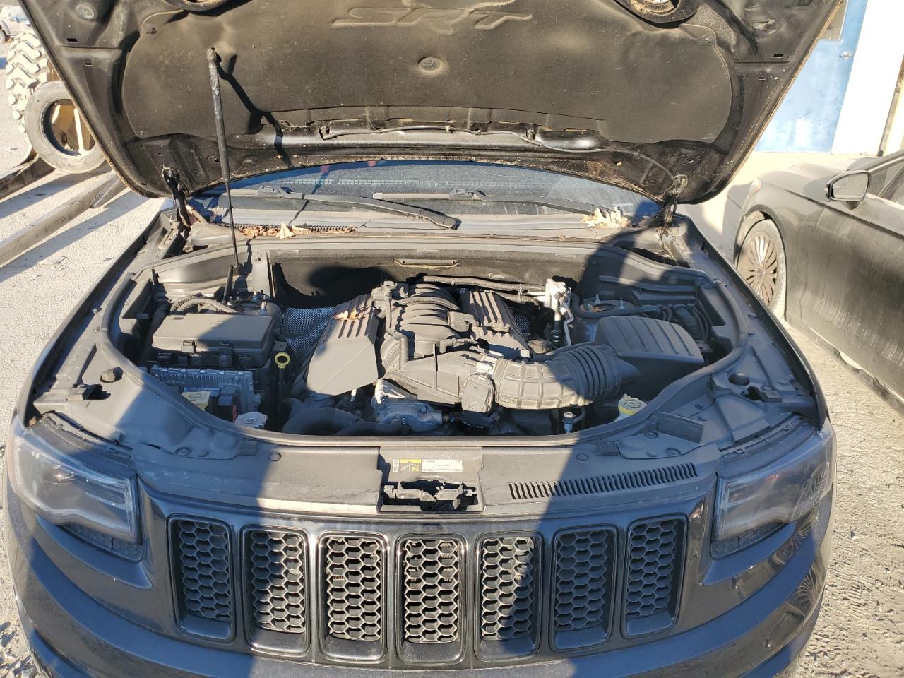 2015 Jeep Grand Cherokee VIN 1C4RJFDJ9FC712203 Copart auction photo, side / rear end damage thumbnail 12