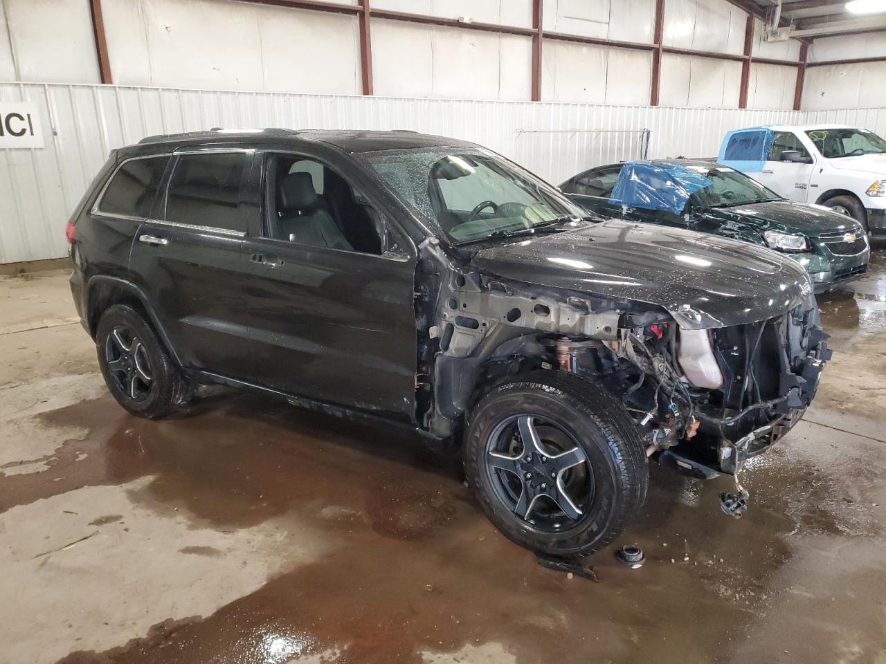 2014 Jeep Grand Cherokee VIN 1C4RJFBG3EC373282 Copart auction photo, front end / side damage thumbnail 4