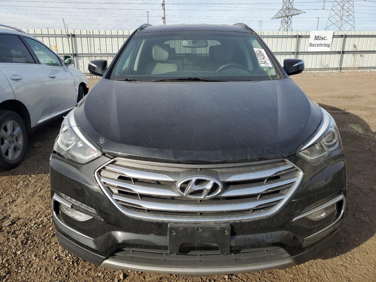 2017 Hyundai Santa Fe VIN 5XYZUDLA1HG479476 Copart auction photo, front end / minor dent/scratches damage thumbnail 5