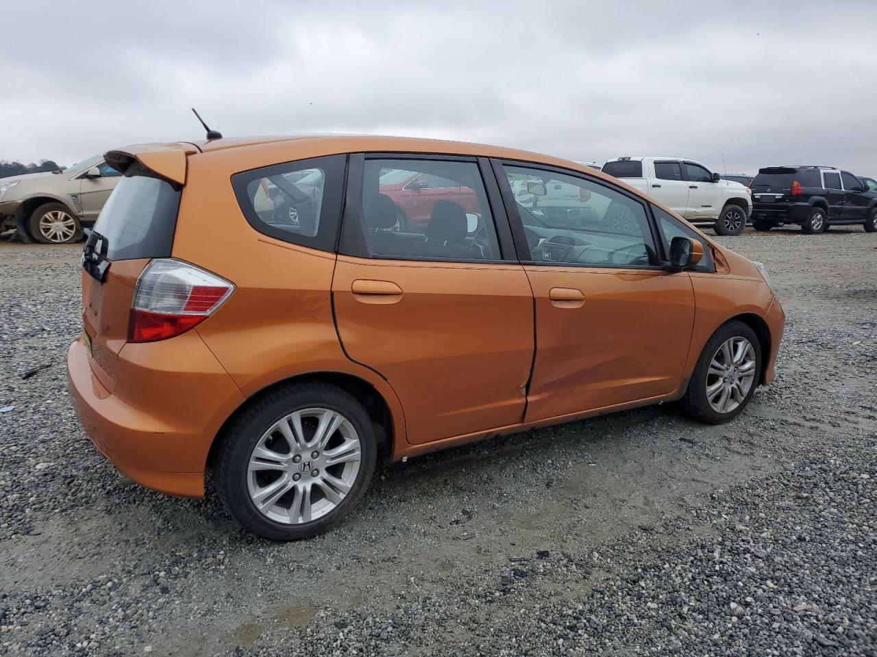 2010 Honda Fit VIN JHMGE8H67AC015293 Copart auction photo, side / front end damage thumbnail 3