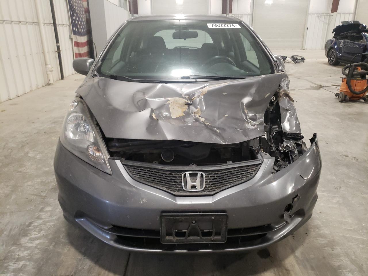 2012 Honda Fit VIN JHMGE8G30CC030342 Copart auction photo, front end / side damage thumbnail 5