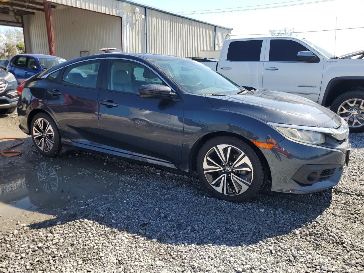 2017 Honda Civic VIN 2HGFC1F34HH646465 Copart auction photo, water/flood damage thumbnail 4