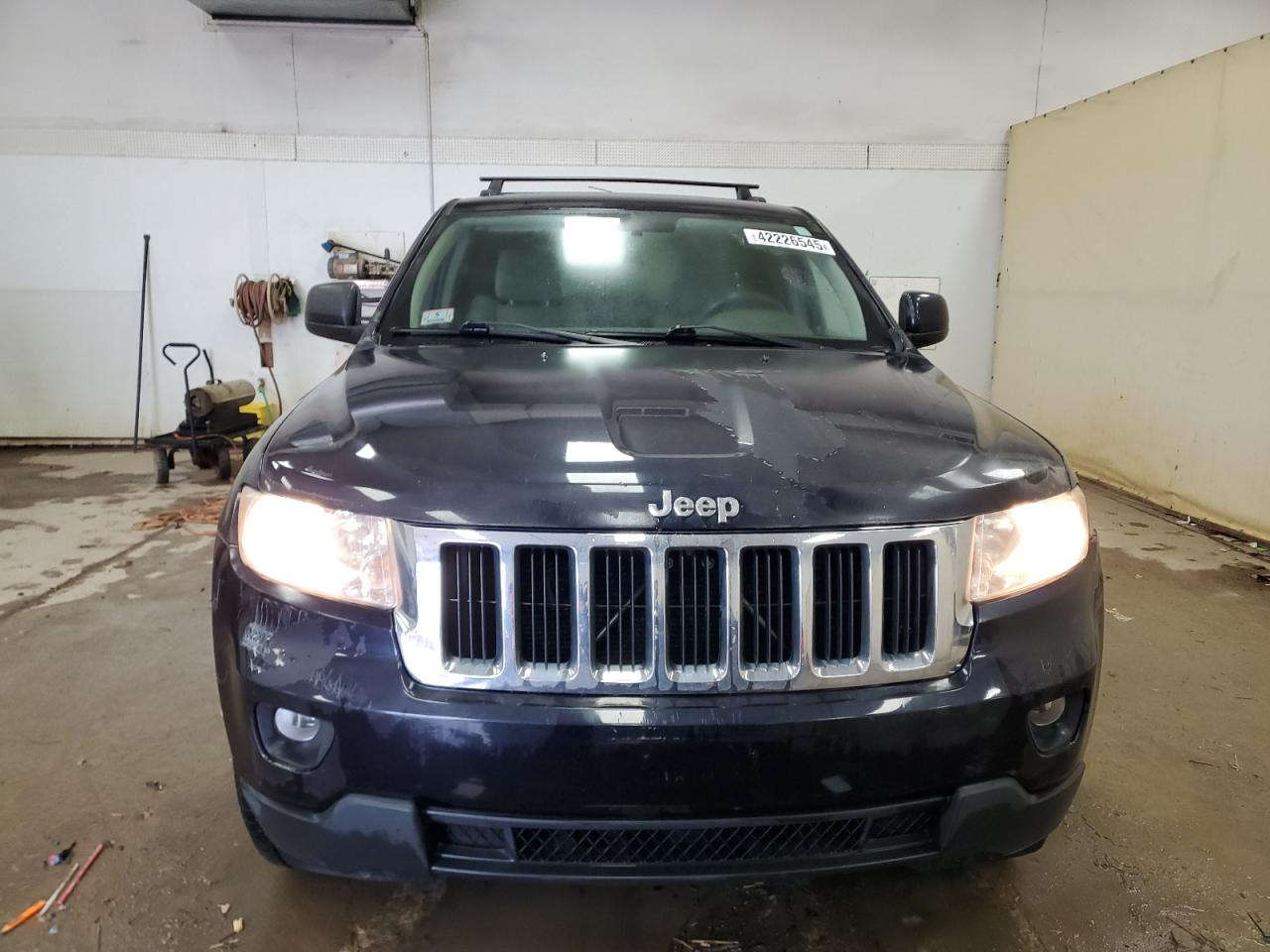 2011 Jeep Grand Cherokee VIN 1J4RR4GG1BC512613 Copart auction photo, side damage thumbnail 5