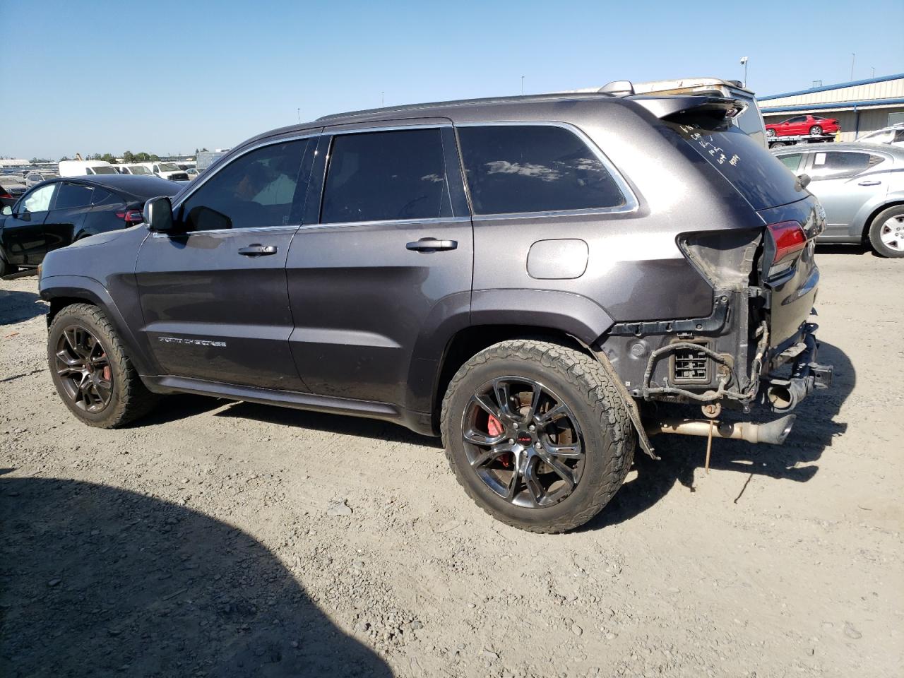 2015 Jeep Grand Cherokee VIN 1C4RJFDJ7FC620006 Copart auction photo, vandalism / stripped damage thumbnail 2