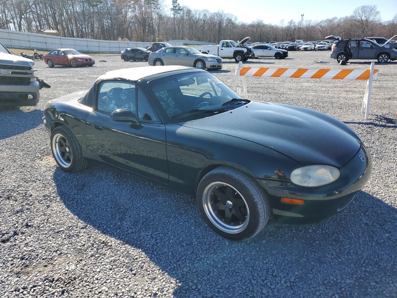 1999 Mazda MX-5 VIN JM1NB3535X0115854 Copart auction photo, side / front end damage thumbnail 4