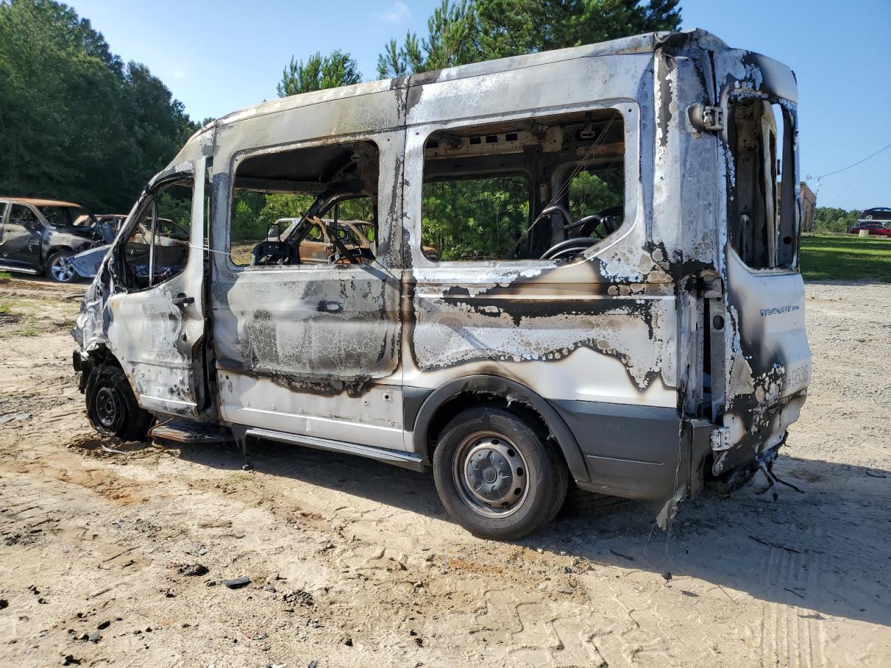 2015 Ford Transit VIN 1FTNE1CM9FKB05709 Copart auction photo, burn damage thumbnail 2