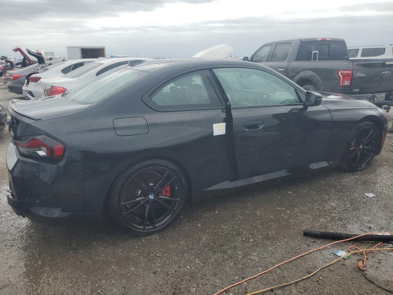 2024 BMW 2er VIN 3MW23CM08R8E46778 Copart auction photo, water/flood / rear end damage thumbnail 3