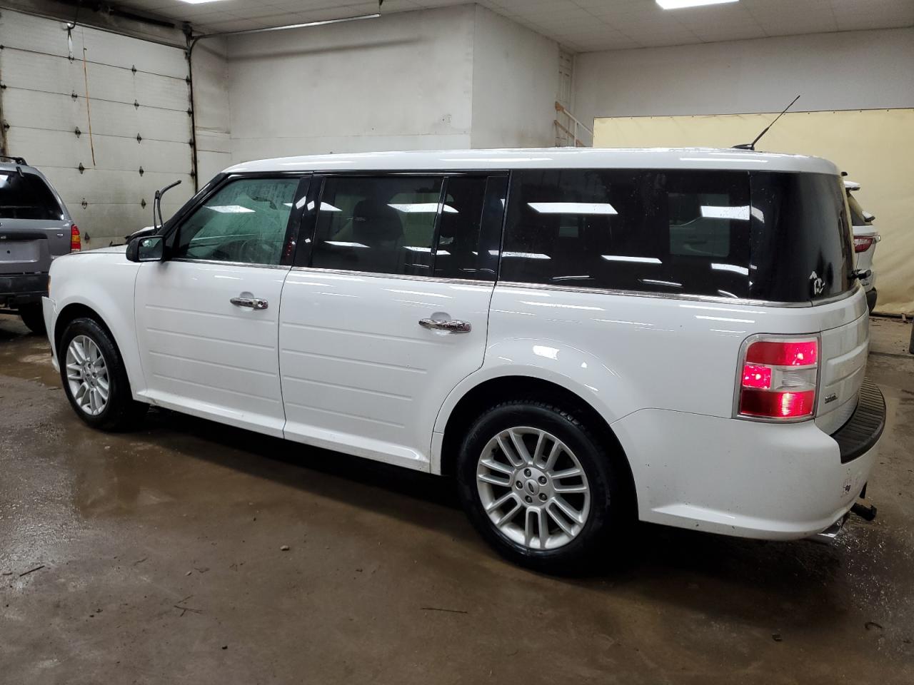 2018 Ford Flex VIN 2FMGK5C89JBA00582 Copart auction photo, front end / side damage thumbnail 2