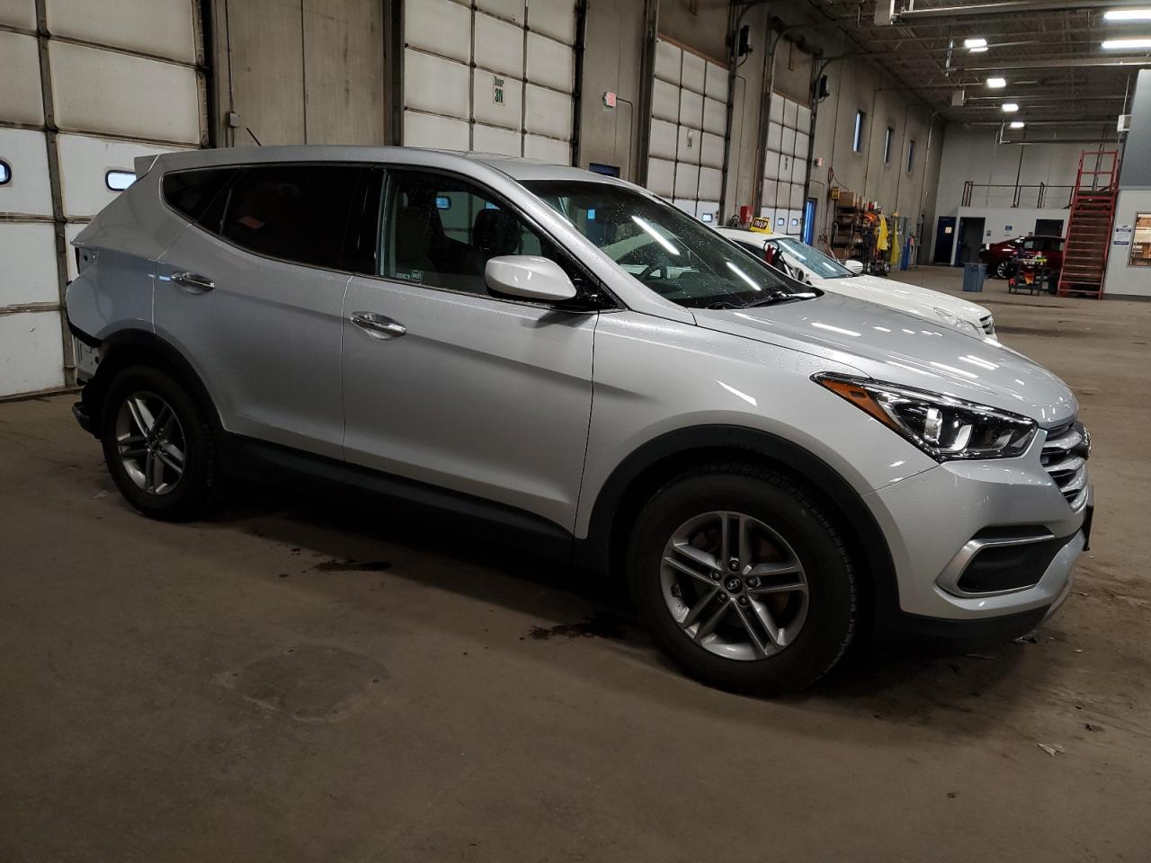 2018 Hyundai Santa Fe VIN 5XYZTDLB5JG570011 Copart auction photo, rear end damage thumbnail 4
