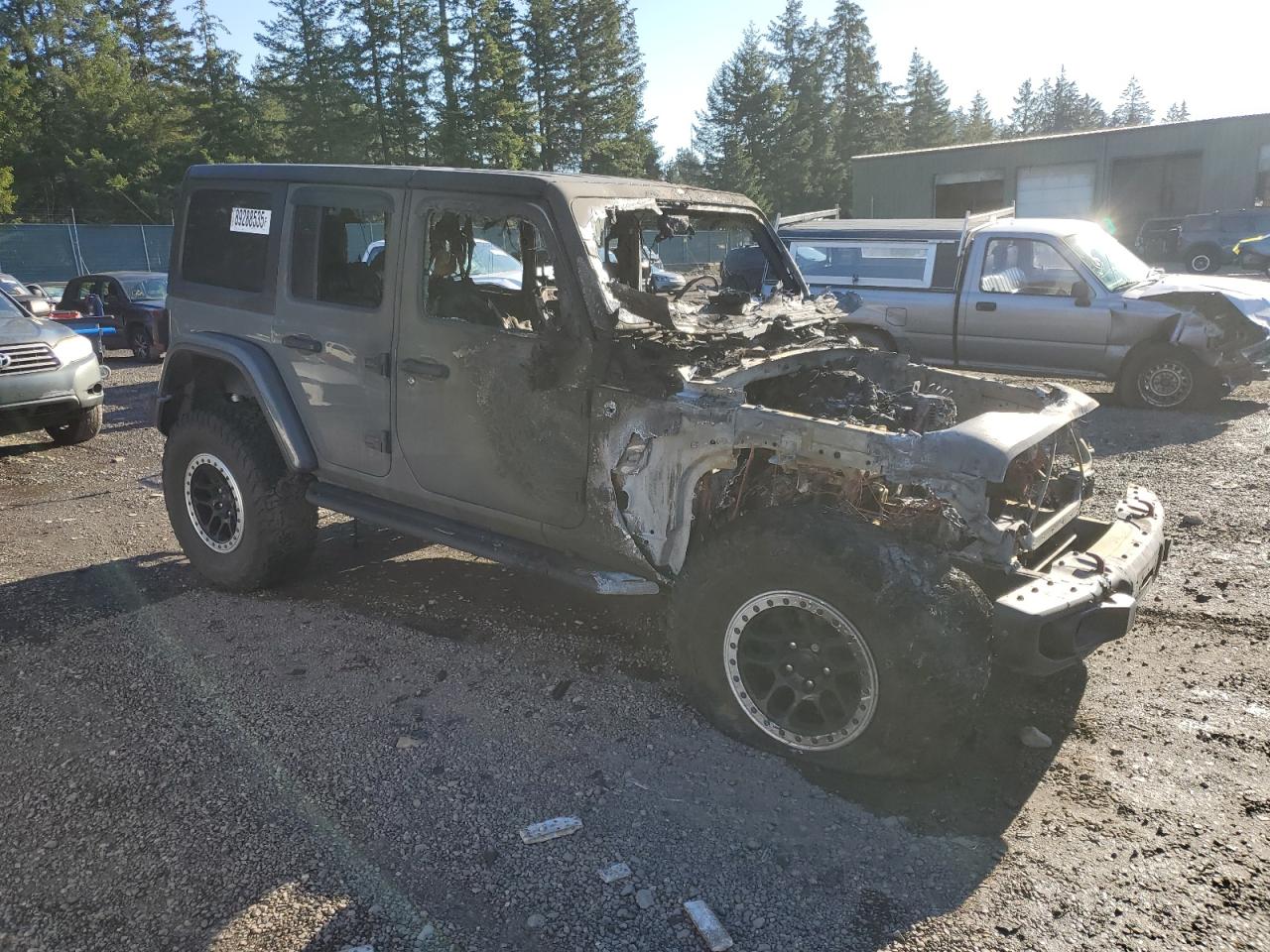 2019 Jeep Wrangler VIN 1C4HJXFG4KW611324 Copart auction photo, burn damage thumbnail 4