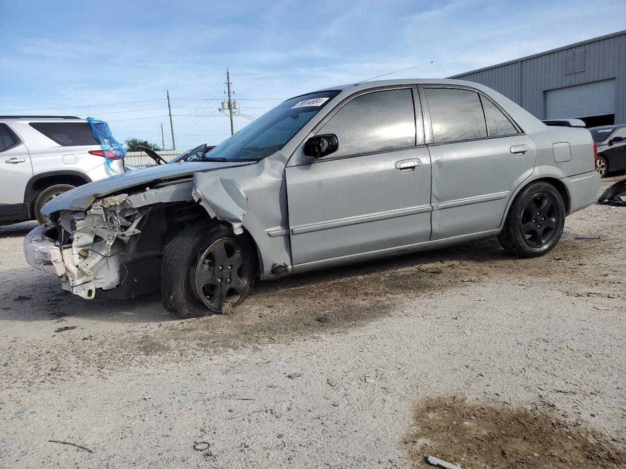 2000 Mazda Protege VIN JM1BJ2221Y0310055 - Copart auction photo