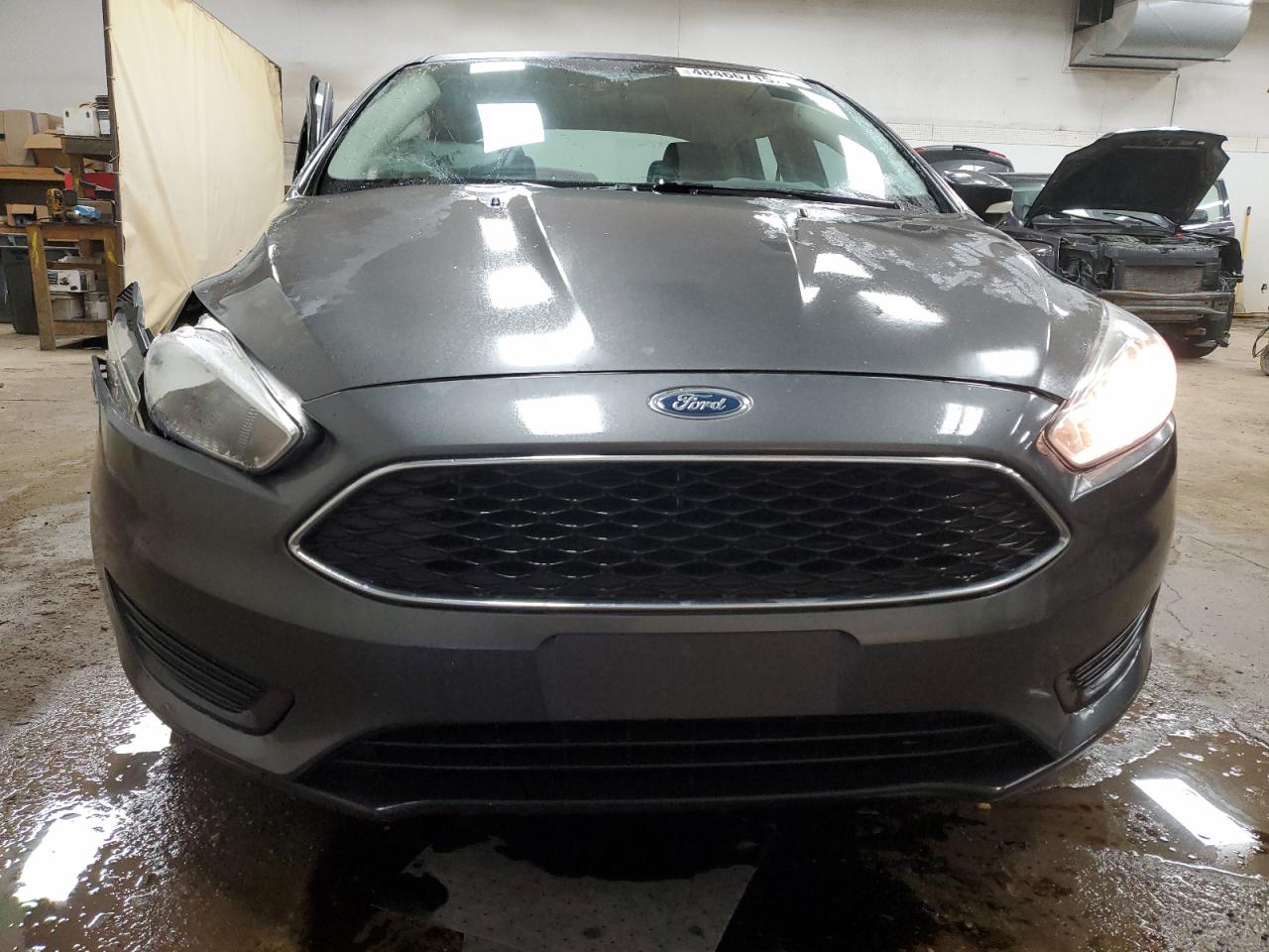 2016 Ford Focus VIN 1FADP3F22GL208385 Copart auction photo, side / front end damage thumbnail 5