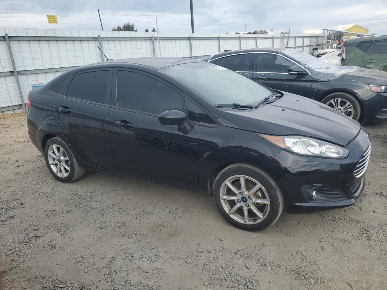 2019 Ford Fiesta VIN 3FADP4BJ1KM137058 Copart auction photo, vandalism damage thumbnail 4