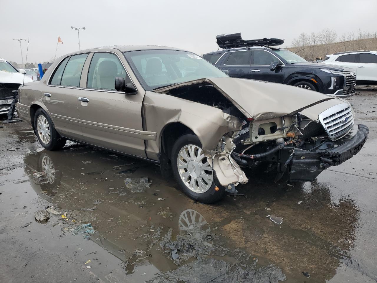 2005 Ford Crown Victoria VIN 2FAFP74W05X122403 Copart auction photo, front end / hail damage thumbnail 4