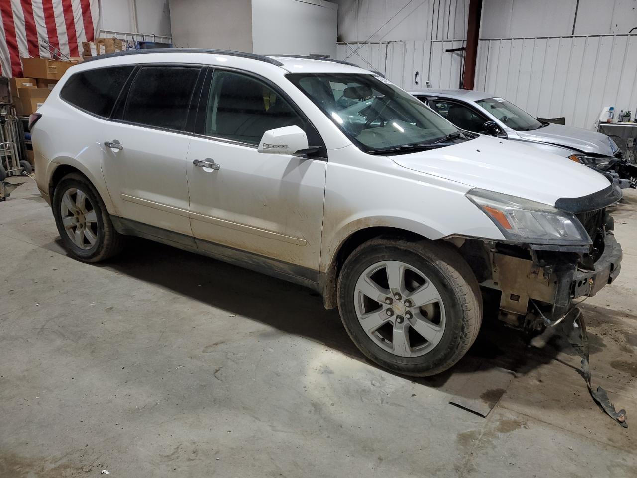 2016 Chevrolet Traverse VIN 1GNKVGKD9GJ315720 Copart auction photo, front end / hail damage thumbnail 4
