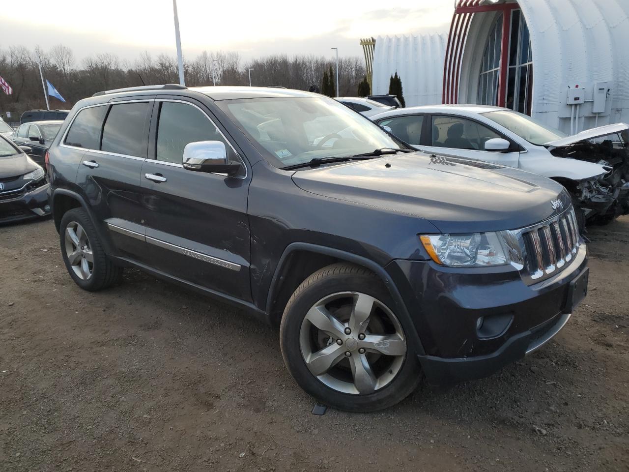 2013 Jeep Grand Cherokee VIN 1C4RJFBG8DC580572 Copart auction photo, minor dent/scratches damage thumbnail 4