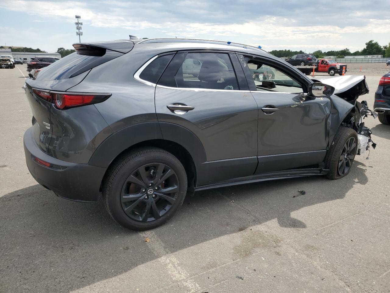 2023 Mazda CX-30 VIN 3MVDMBDY0PM569986 Copart auction photo, front end / rear end damage thumbnail 3