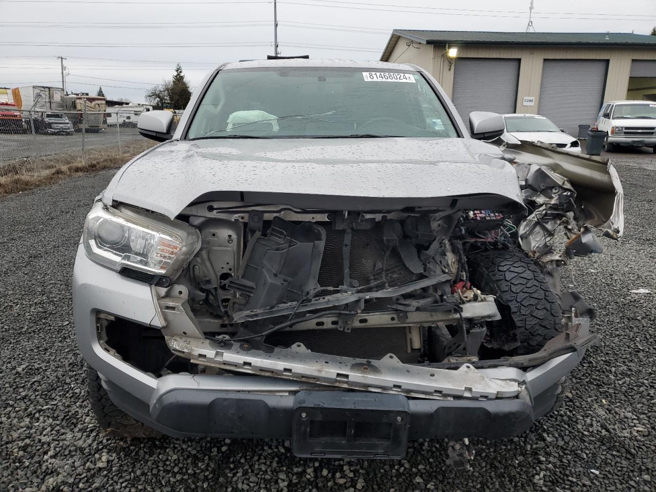 2016 Toyota Tacoma VIN 5TFSZ5AN7GX020981 Copart auction photo, front end / side damage thumbnail 5