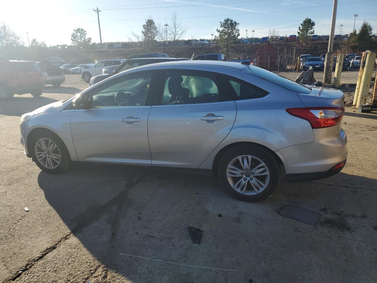 2012 Ford Focus VIN 1FAHP3H23CL309637 Copart auction photo, side damage thumbnail 2