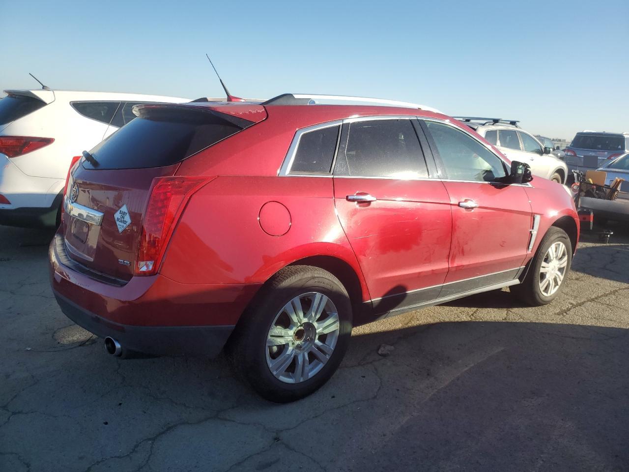 2012 Cadillac SRX VIN 3GYFNAE37CS588863 Copart auction photo, minor dent/scratches damage thumbnail 3