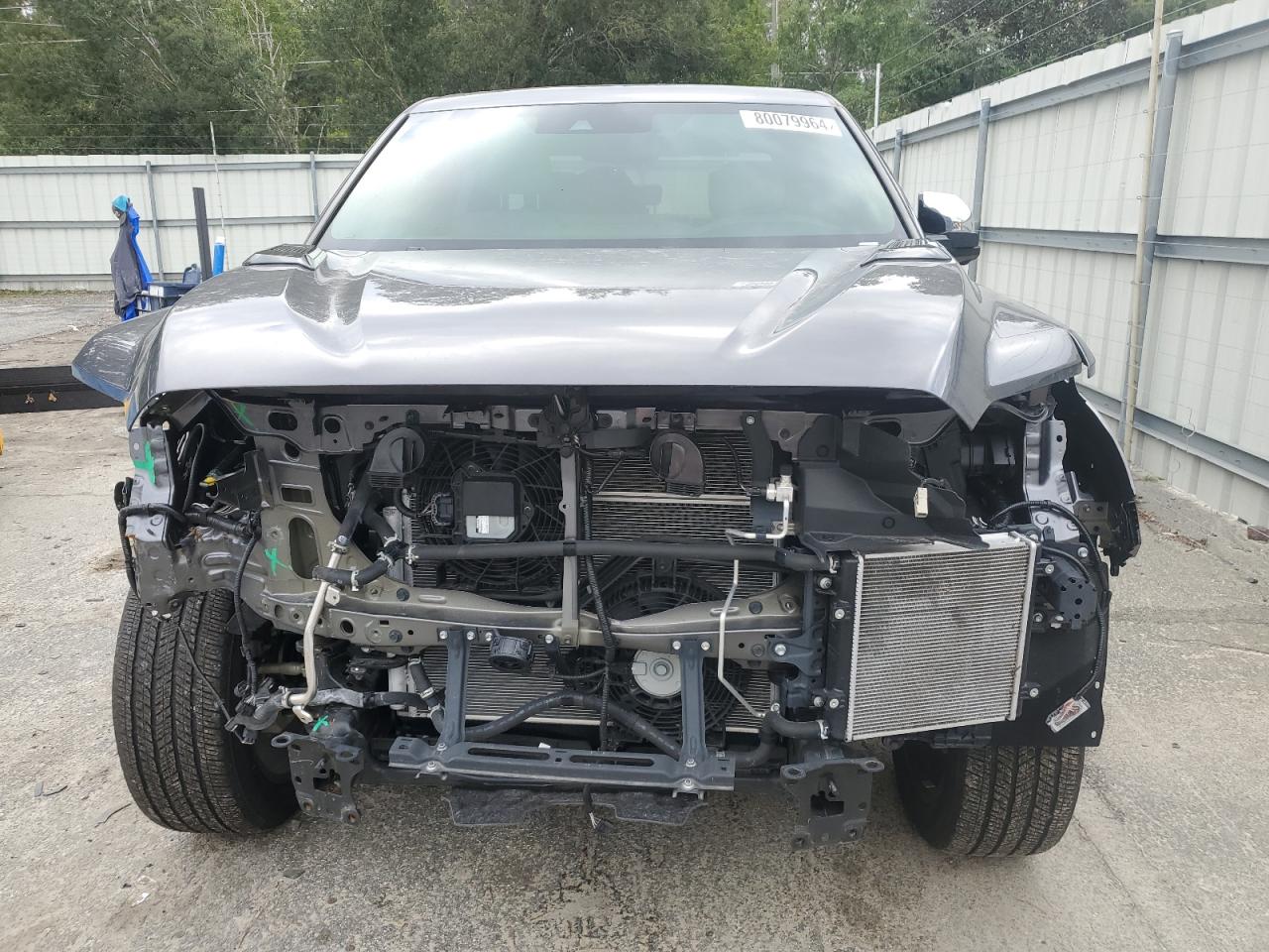 2023 Toyota Tundra VIN 5TFVC5DBXPX028881 Copart auction photo, front end / side damage thumbnail 5