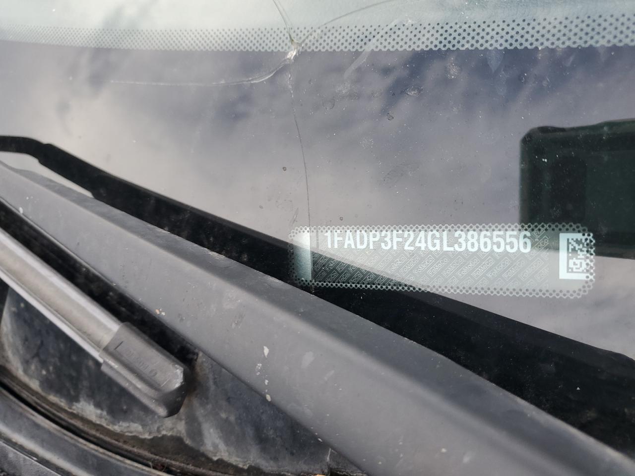 2016 Ford Focus VIN 1FADP3F24GL386556 Copart auction photo, side / front end damage thumbnail 12
