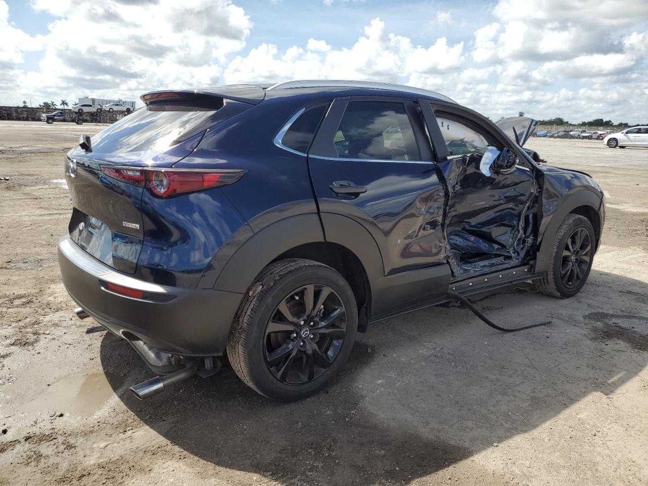 2024 Mazda CX-30 VIN 3MVDMBBM1RM660090 Copart auction photo, side / front end damage thumbnail 3