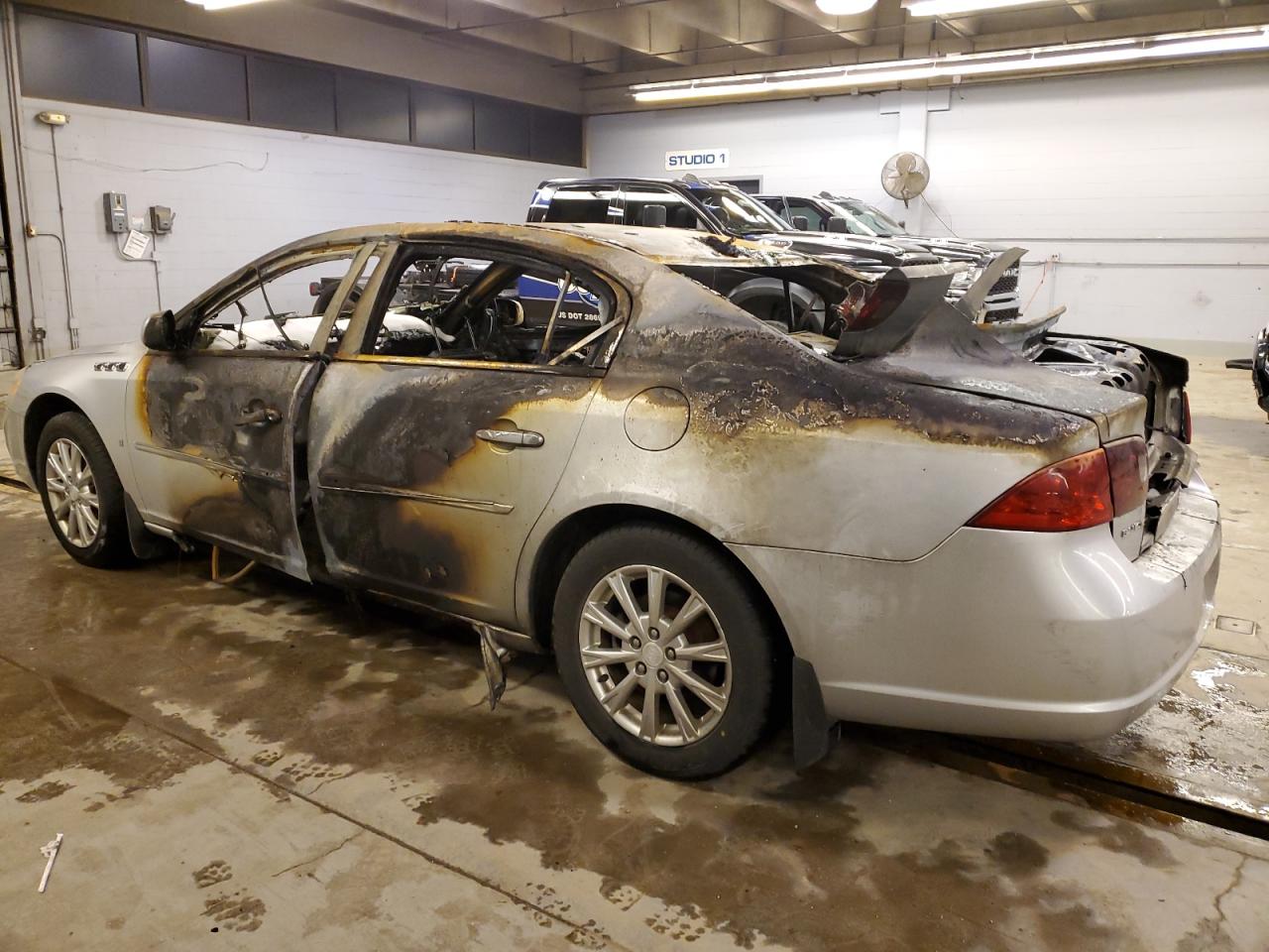 2009 Buick Lucerne VIN 1G4HP57199U107947 Copart auction photo, burn / rear end damage thumbnail 2