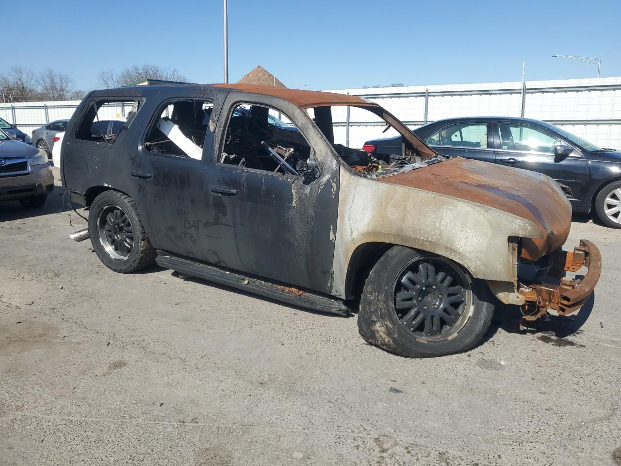 2010 Chevrolet Tahoe VIN 1GNMCAE02AR257012 Copart auction photo, burn damage thumbnail 4