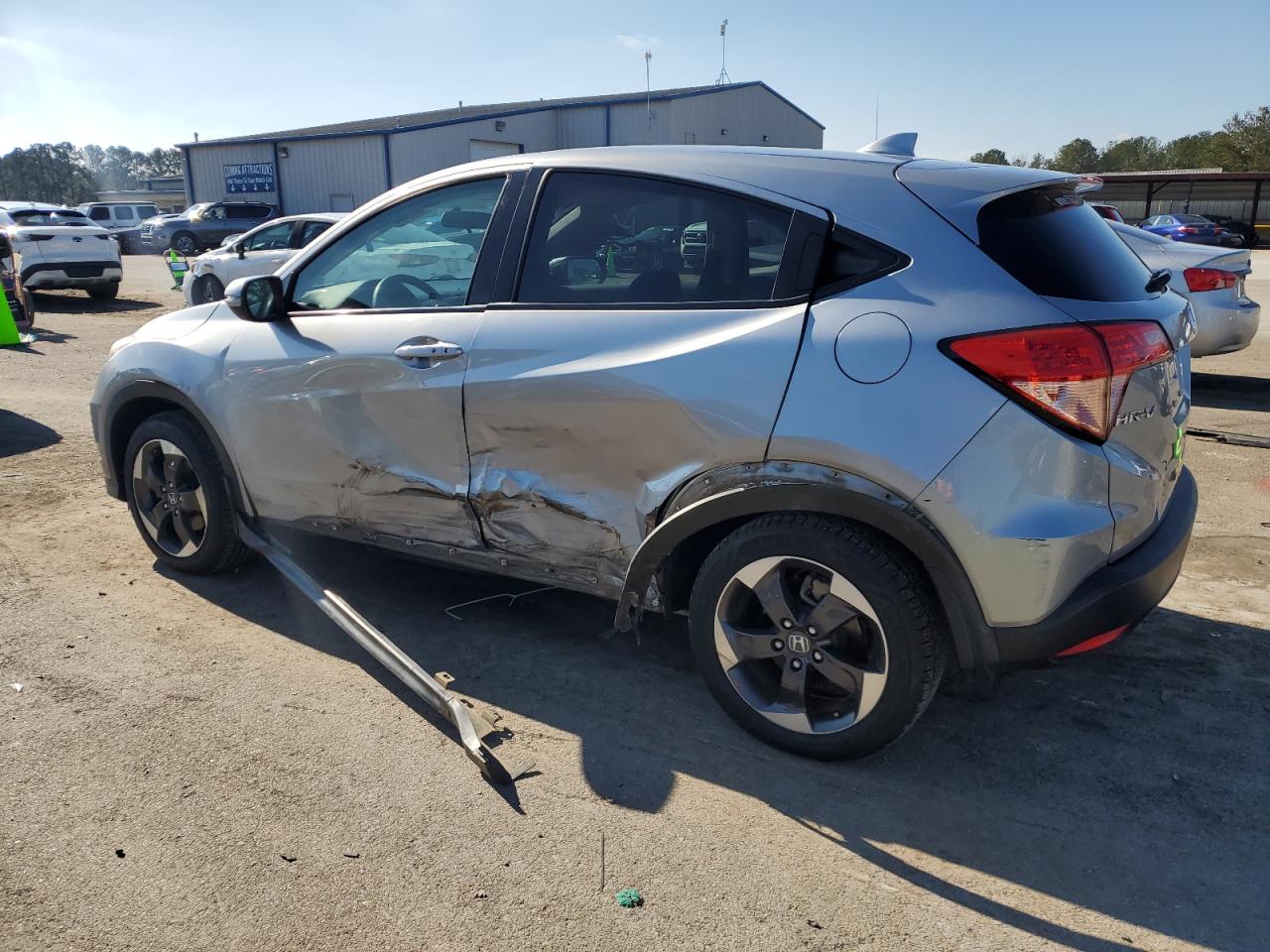 2018 Honda HR-V VIN 3CZRU6H53JG703890 Copart auction photo, side / minor dent/scratches damage thumbnail 2