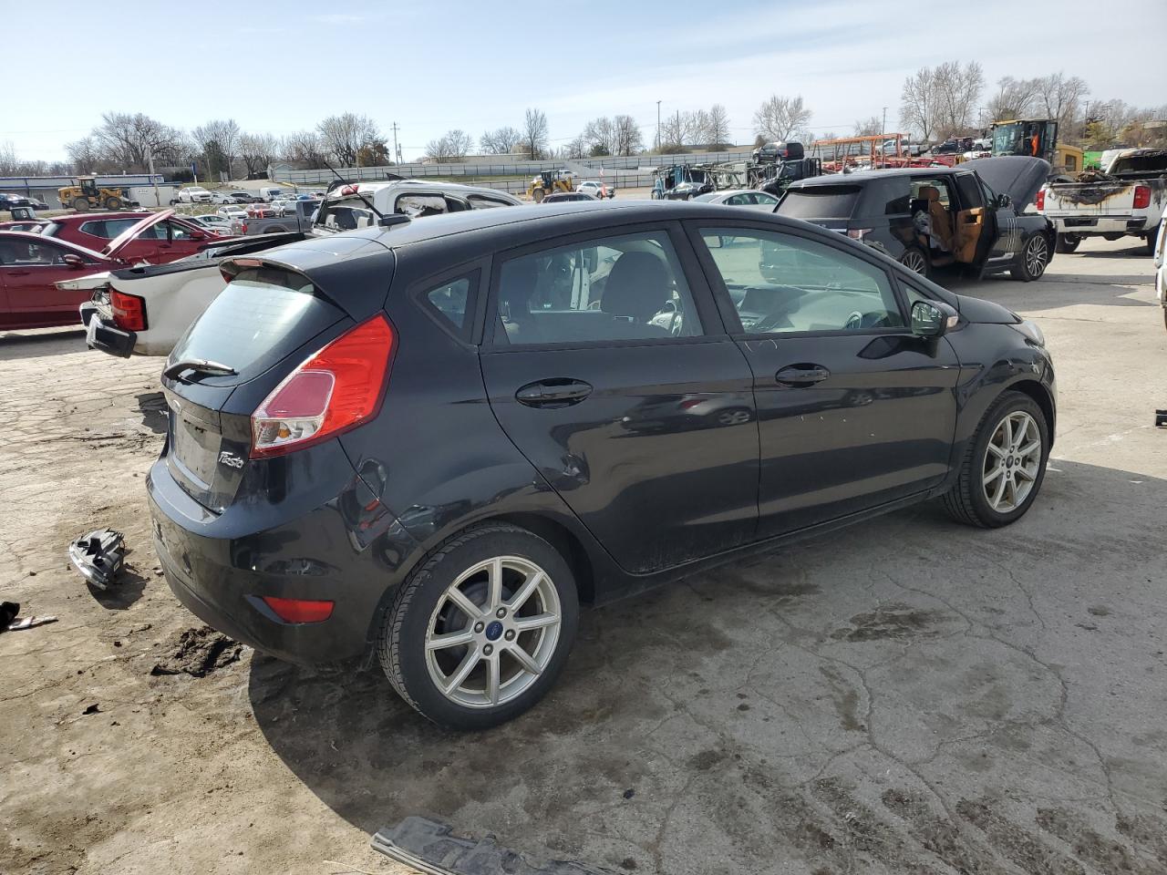 2015 Ford Fiesta VIN 3FADP4EJ4FM105822 Copart auction photo, front end / all over damage thumbnail 3