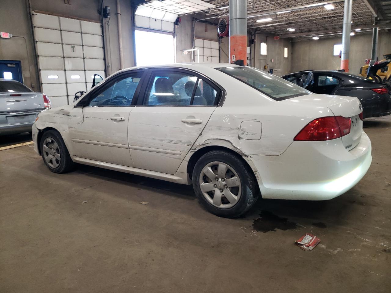 2009 KIA Optima VIN KNAGE228695322461 Copart auction photo, side / front end damage thumbnail 2
