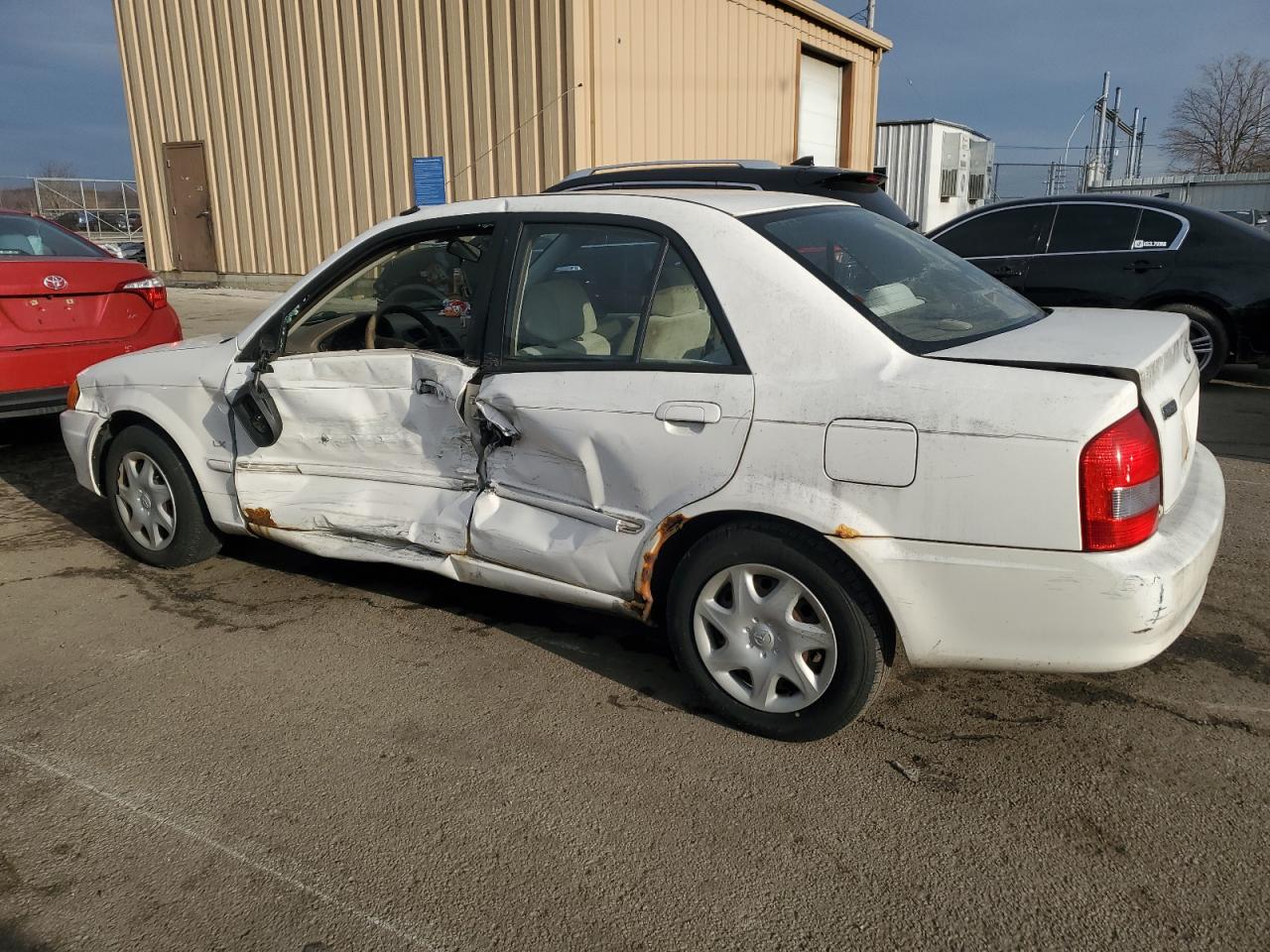 2000 Mazda Protege VIN JM1BJ2221Y0267708 Copart auction photo, side / front end damage thumbnail 2