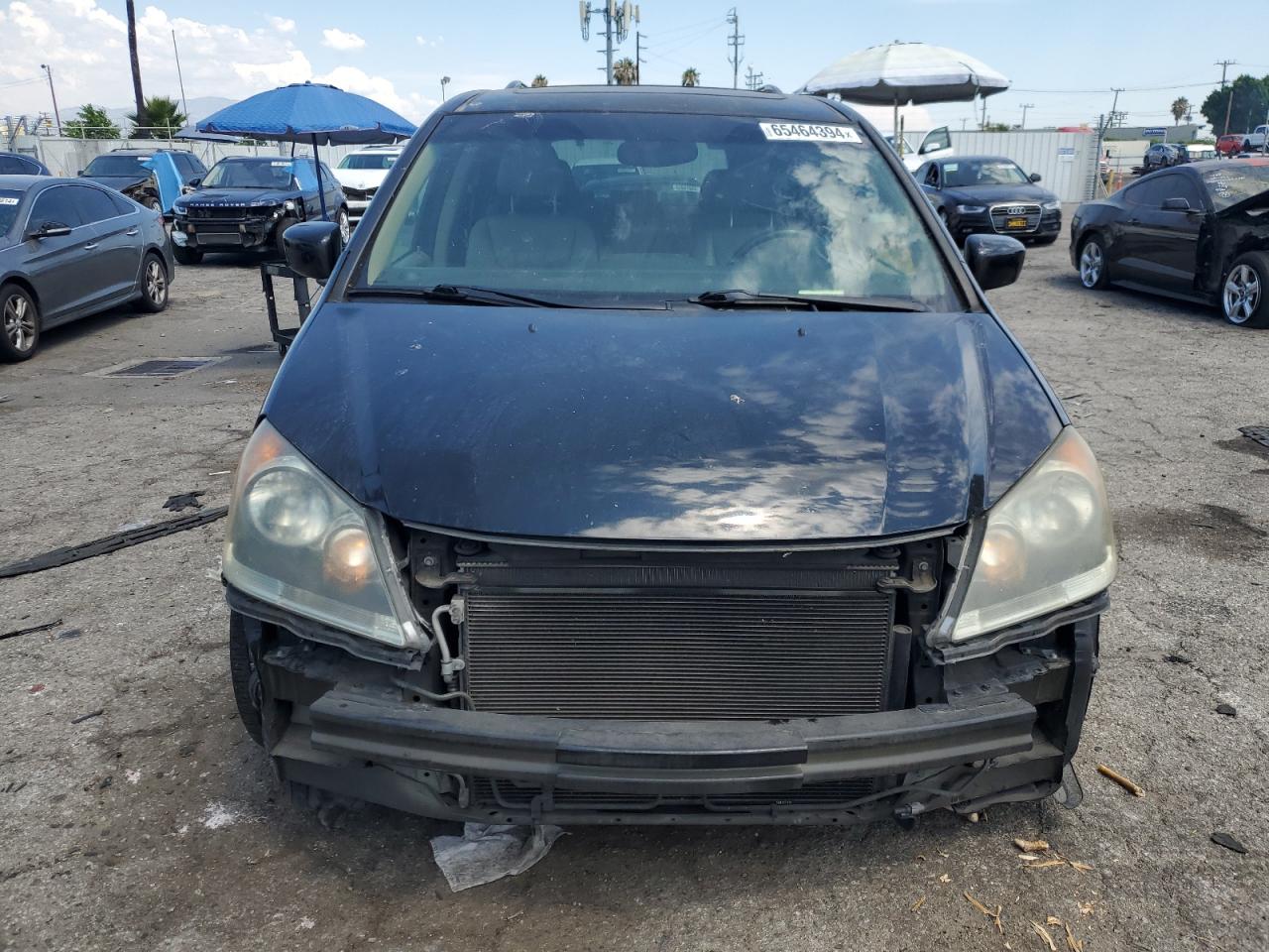 2009 Honda Odyssey VIN 5FNRL38749B056104 Copart auction photo, front end / rear end damage thumbnail 5