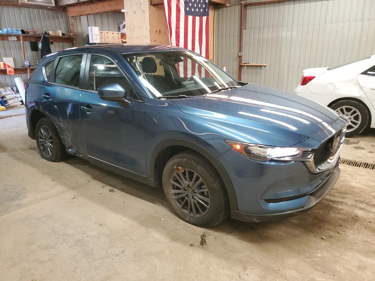 2020 Mazda CX-5 VIN JM3KFBBM4L0799974 Copart auction photo, side damage thumbnail 4