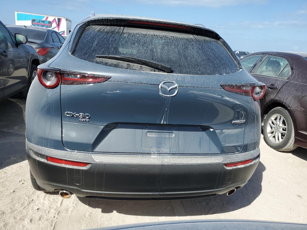 2023 Mazda CX-30 VIN 3MVDMBCM2PM563279 Copart auction photo, water/flood damage thumbnail 6