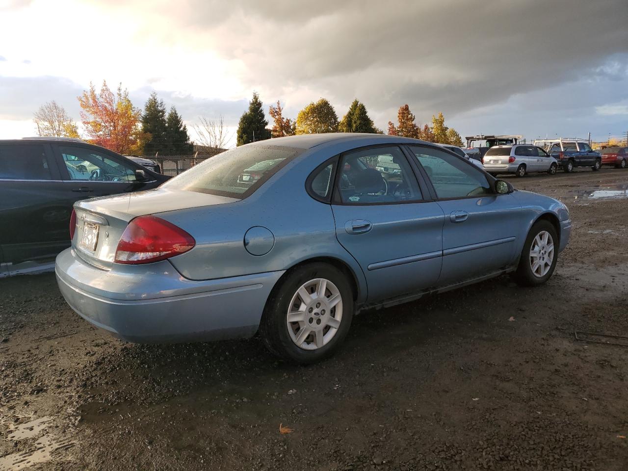 2005 Ford Taurus VIN 1FAFP53205A198585 Copart auction photo, side damage thumbnail 3
