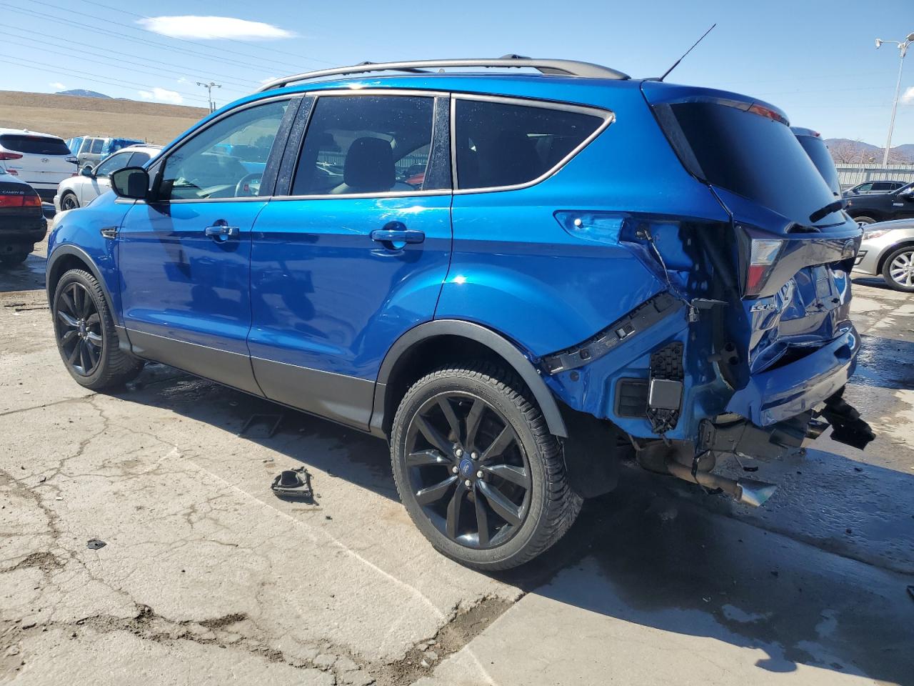 2017 Ford Escape VIN 1FMCU9J9XHUF07765 Copart auction photo, rear end damage thumbnail 2