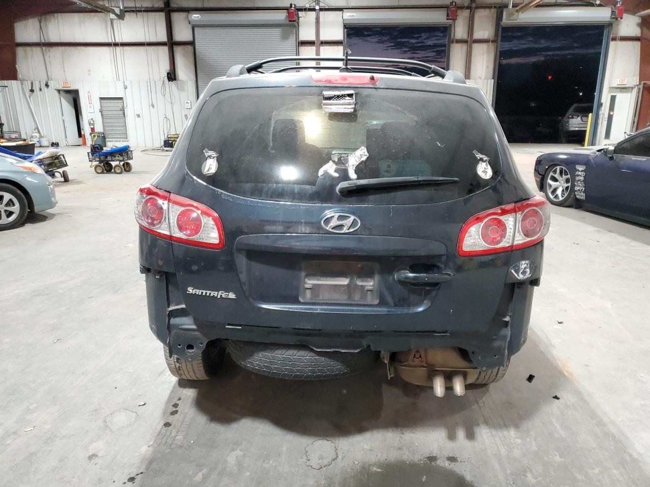 2012 Hyundai Santa Fe VIN 5XYZG3ABXCG116194 Copart auction photo, rear end / minor dent/scratches damage thumbnail 6